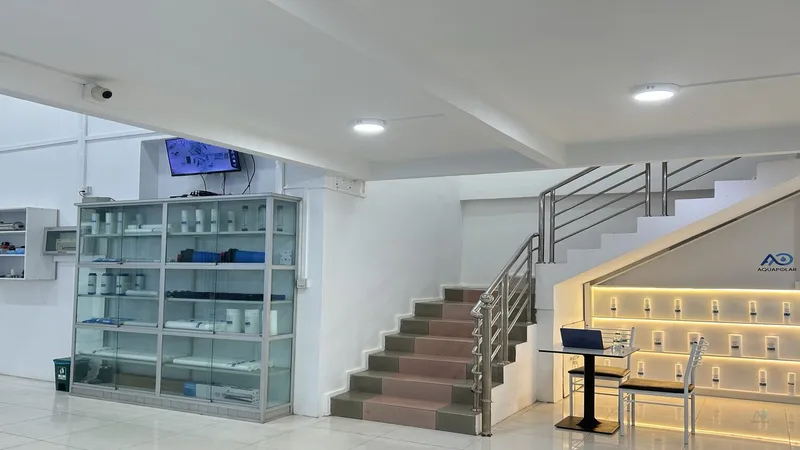 Myanmar homeowner confirming new-apartment RO install fit at the AQUAPOLAR showroom